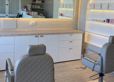 Elegant salon interior at Makeup By Courtney Jade / Coco Brows, Melbourne, Victoria, AU featuring styling chairs.