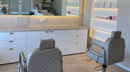 Elegant salon interior at Makeup By Courtney Jade / Coco Brows, Melbourne, Victoria, AU featuring styling chairs.