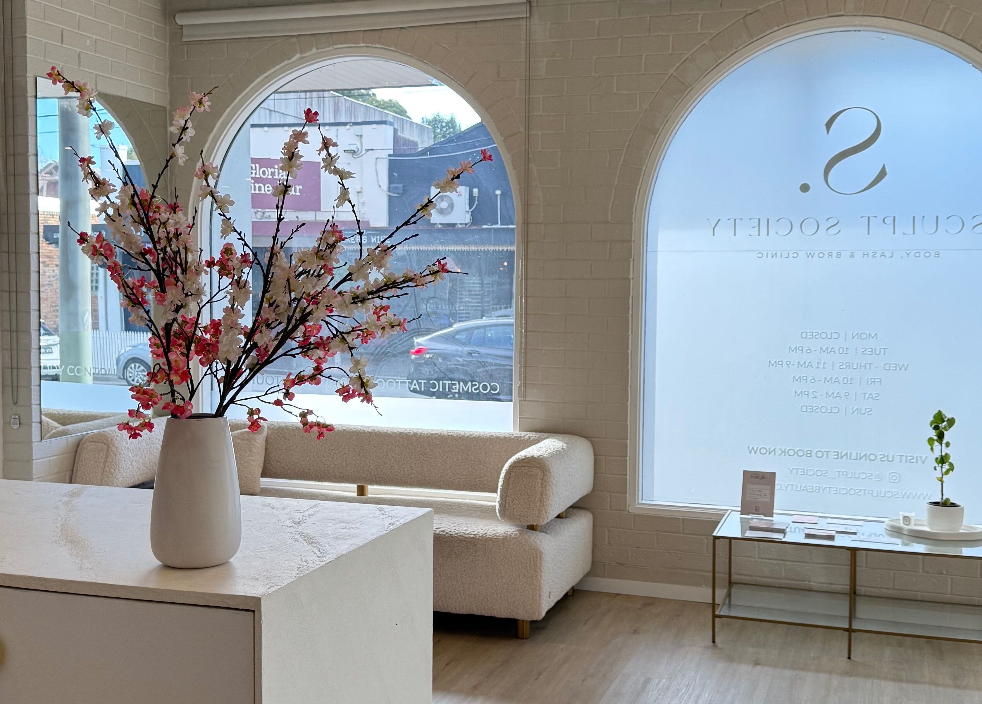 Elegant lounge of Makeup By Courtney Jade / Coco Brows, Melbourne, Victoria, AU, featuring cherry blossom decor.