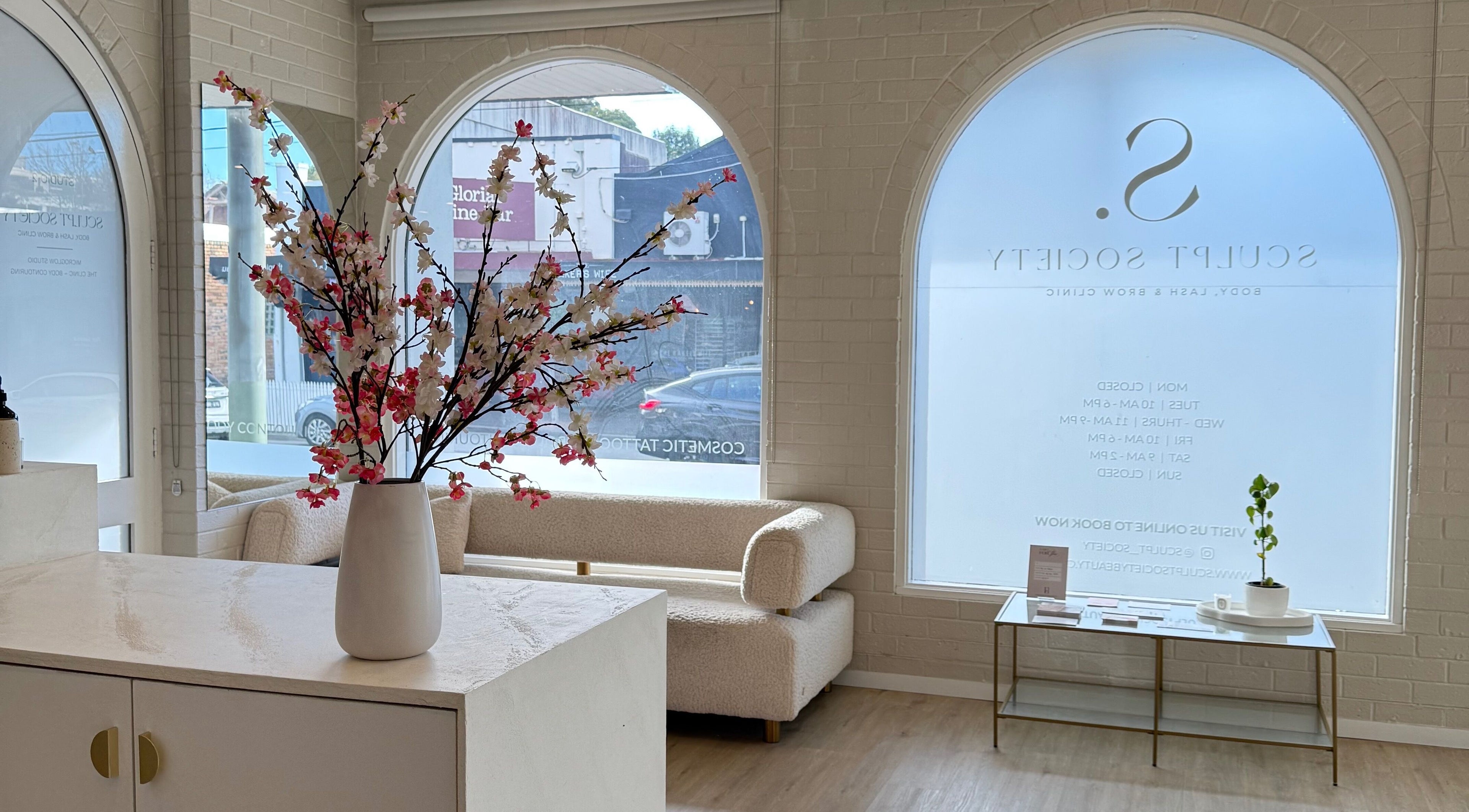 Elegant lounge of Makeup By Courtney Jade / Coco Brows, Melbourne, Victoria, AU, featuring cherry blossom decor.
