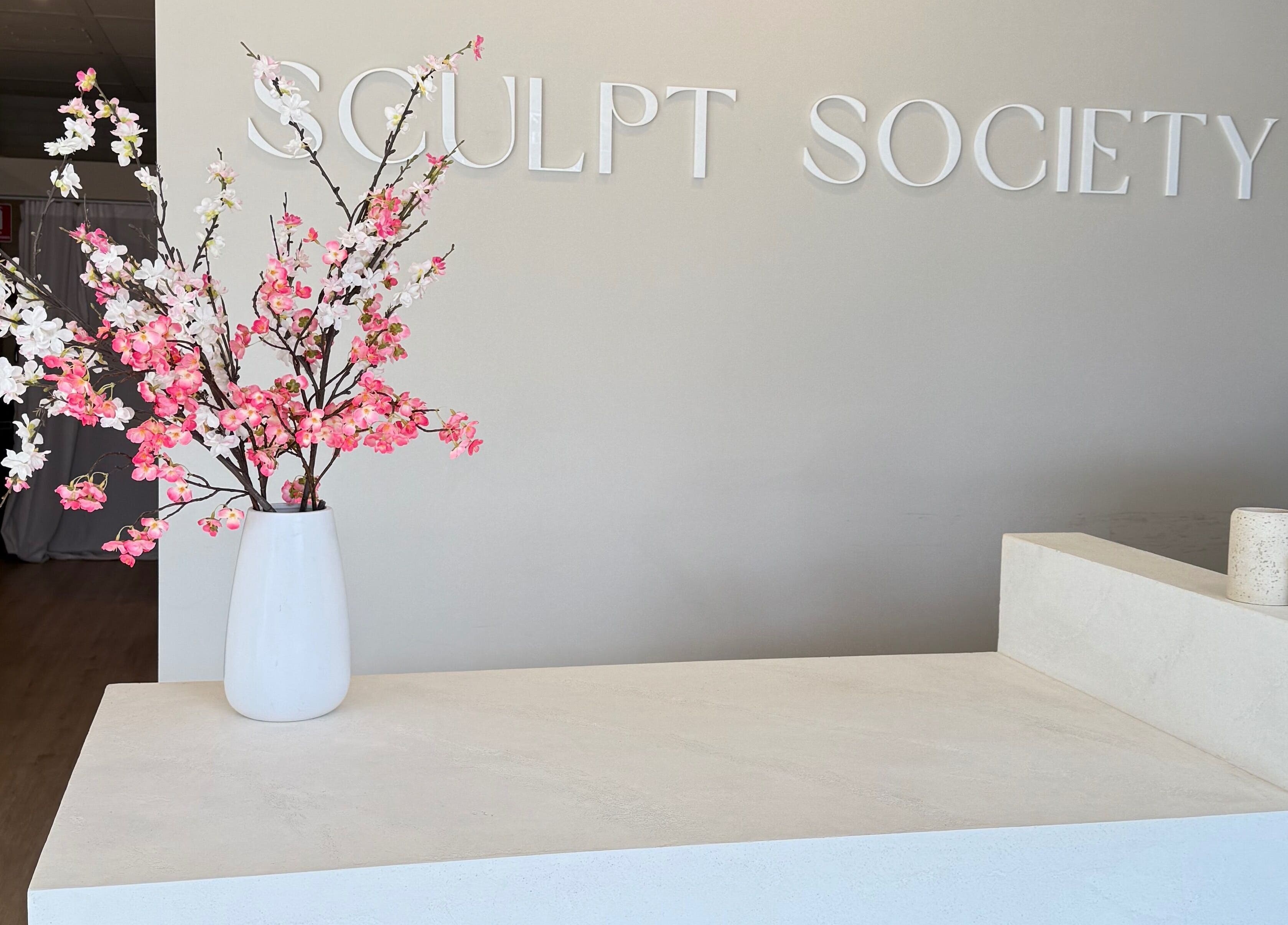 Reception area at Makeup By Courtney Jade / Coco Brows, Melbourne, Victoria, AU with floral decor.