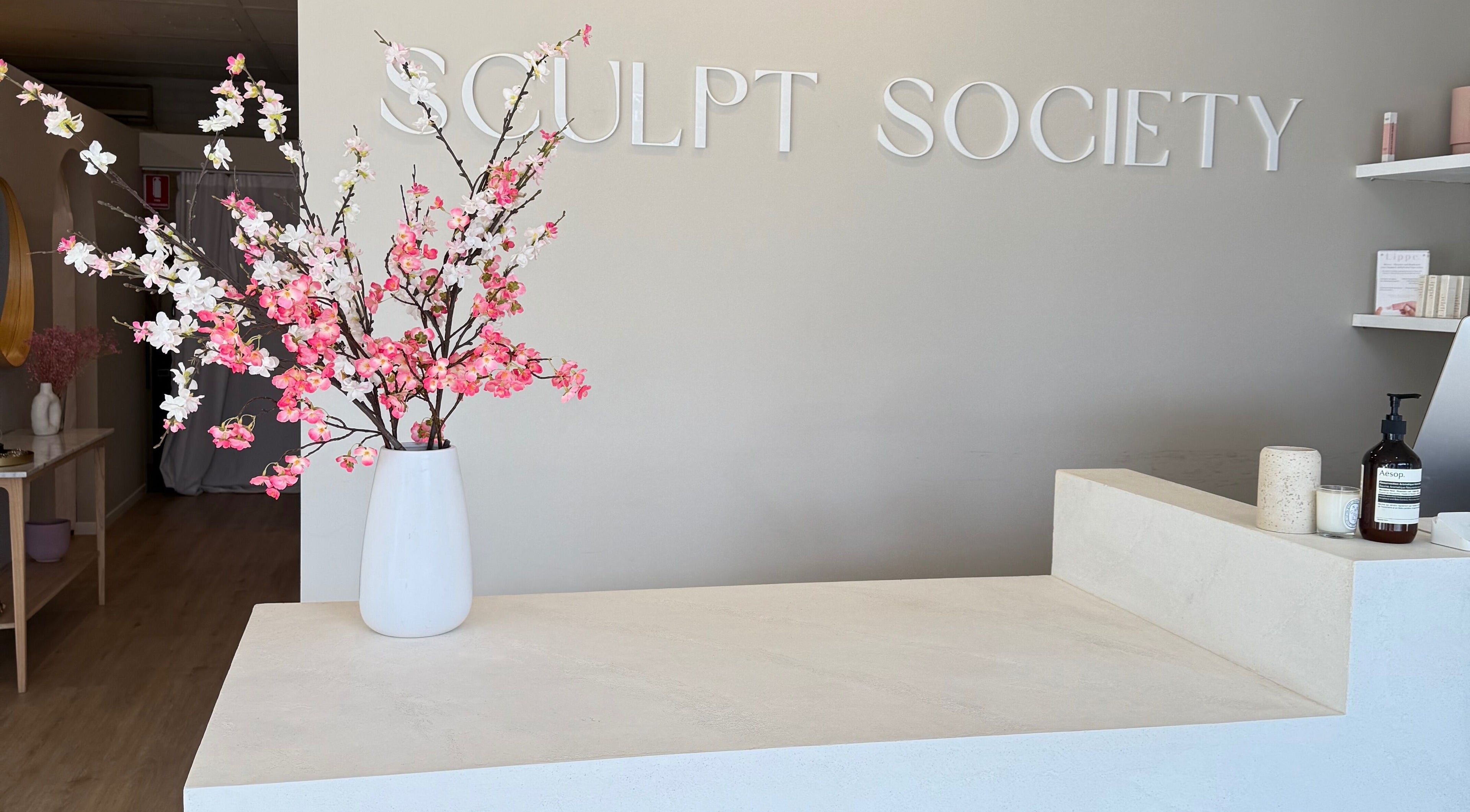 Reception area at Makeup By Courtney Jade / Coco Brows, Melbourne, Victoria, AU with floral decor.