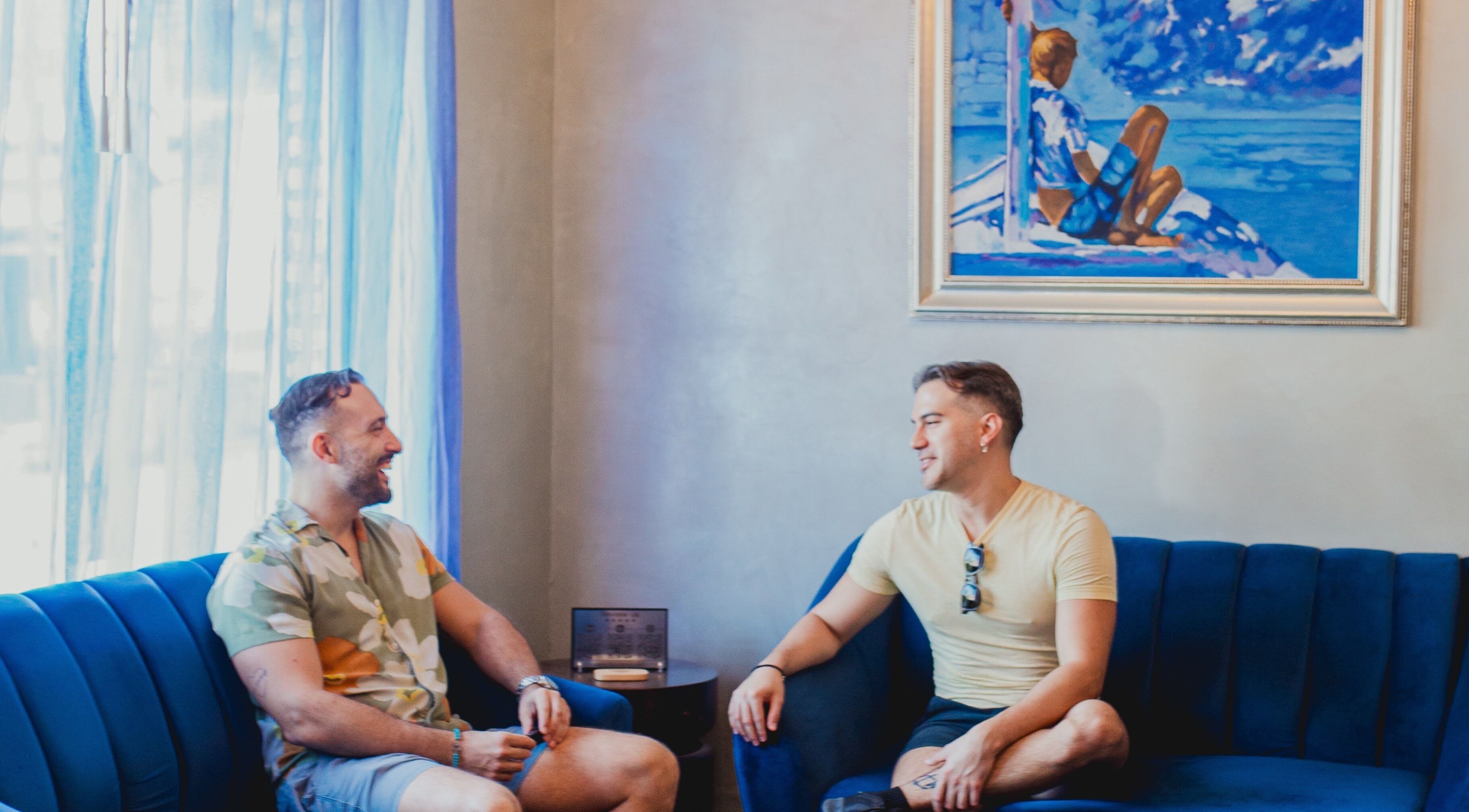 Two men chatting in lounge at Acqua Spa for Men, Puerto Vallarta, Jalisco, MX.