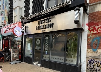 Masters Barbershop storefront with a modern facade in Brighton and Hove, England, GB.