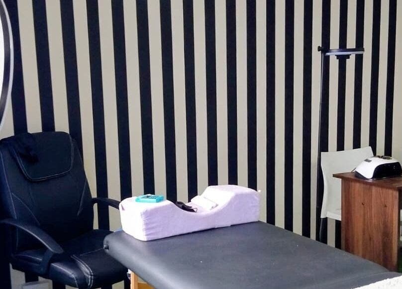 Modern beauty station at GRWM Beauty Bar & Academy in Gqeberha, Eastern Cape, ZA with black-striped walls.