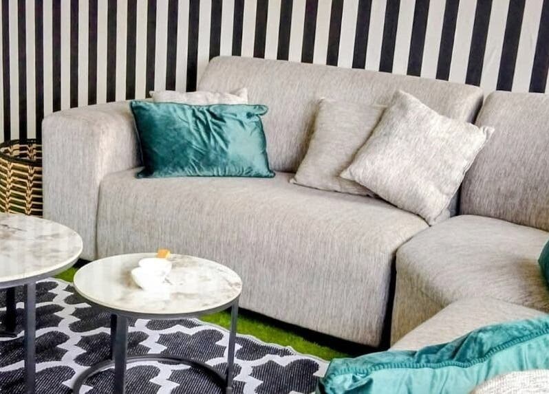 Elegant lounge area at GRWM Beauty Bar & Academy, Gqeberha, Eastern Cape, ZA, featuring plush seating.