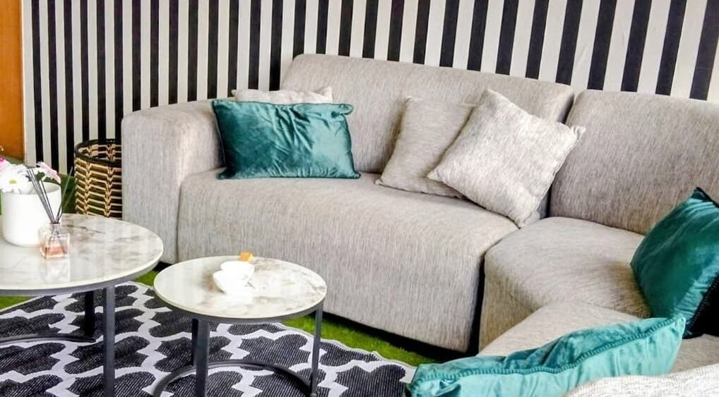 Elegant lounge area at GRWM Beauty Bar & Academy, Gqeberha, Eastern Cape, ZA, featuring plush seating.