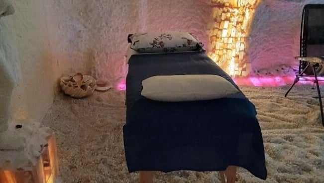 Tranquil salt room with massage table at Oasis of Healing Spa in Waterloo, Ontario, CA.