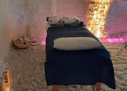 Tranquil salt room with massage table at Oasis of Healing Spa in Waterloo, Ontario, CA.