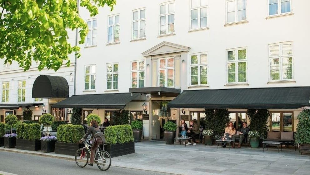 Elegant facade of Hotel SKT. Annæ in København, Denmark, DK, welcoming guests with lush greenery.
