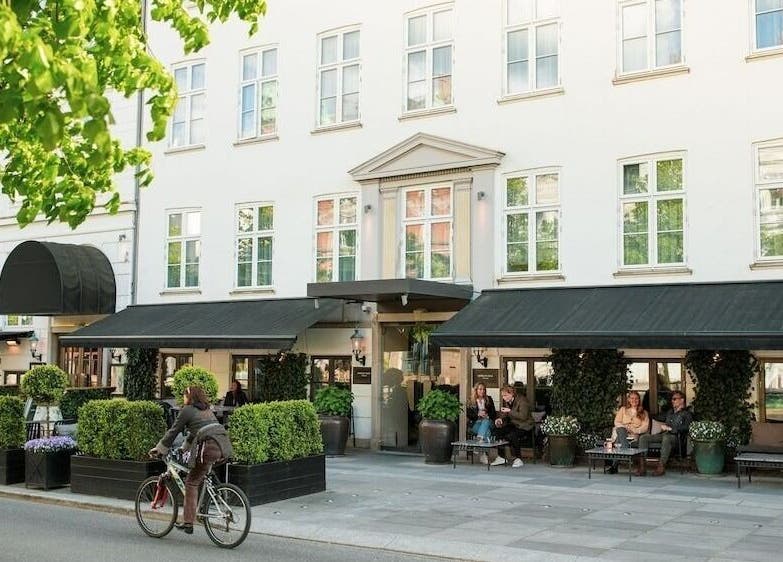 Elegant facade of Hotel SKT. Annæ in København, Denmark, DK, welcoming guests with lush greenery.
