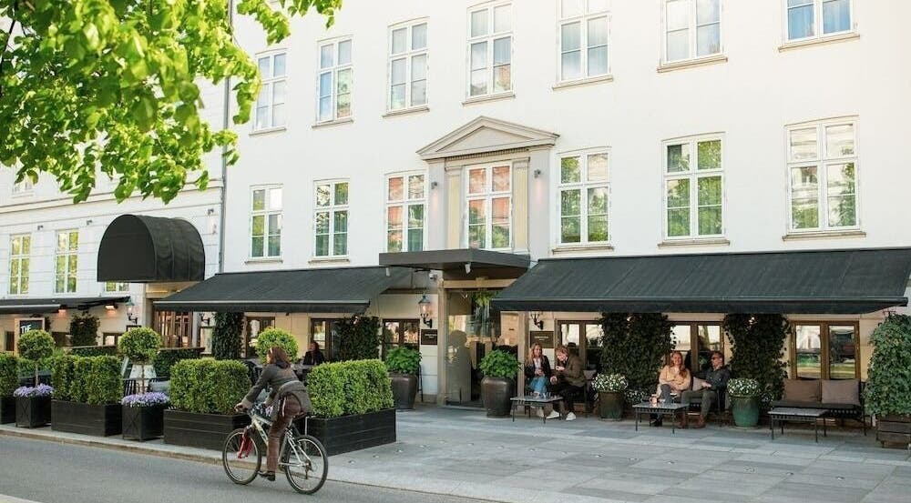 Elegant facade of Hotel SKT. Annæ in København, Denmark, DK, welcoming guests with lush greenery.