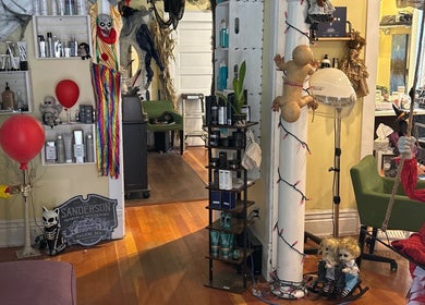 Eccentric decor with mannequins at Hot on Top Salon, Regina, Saskatchewan, CA, showcasing unique interior style.