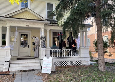 Front porch of Hot on Top Salon with festive decor in Regina, Saskatchewan, CA.