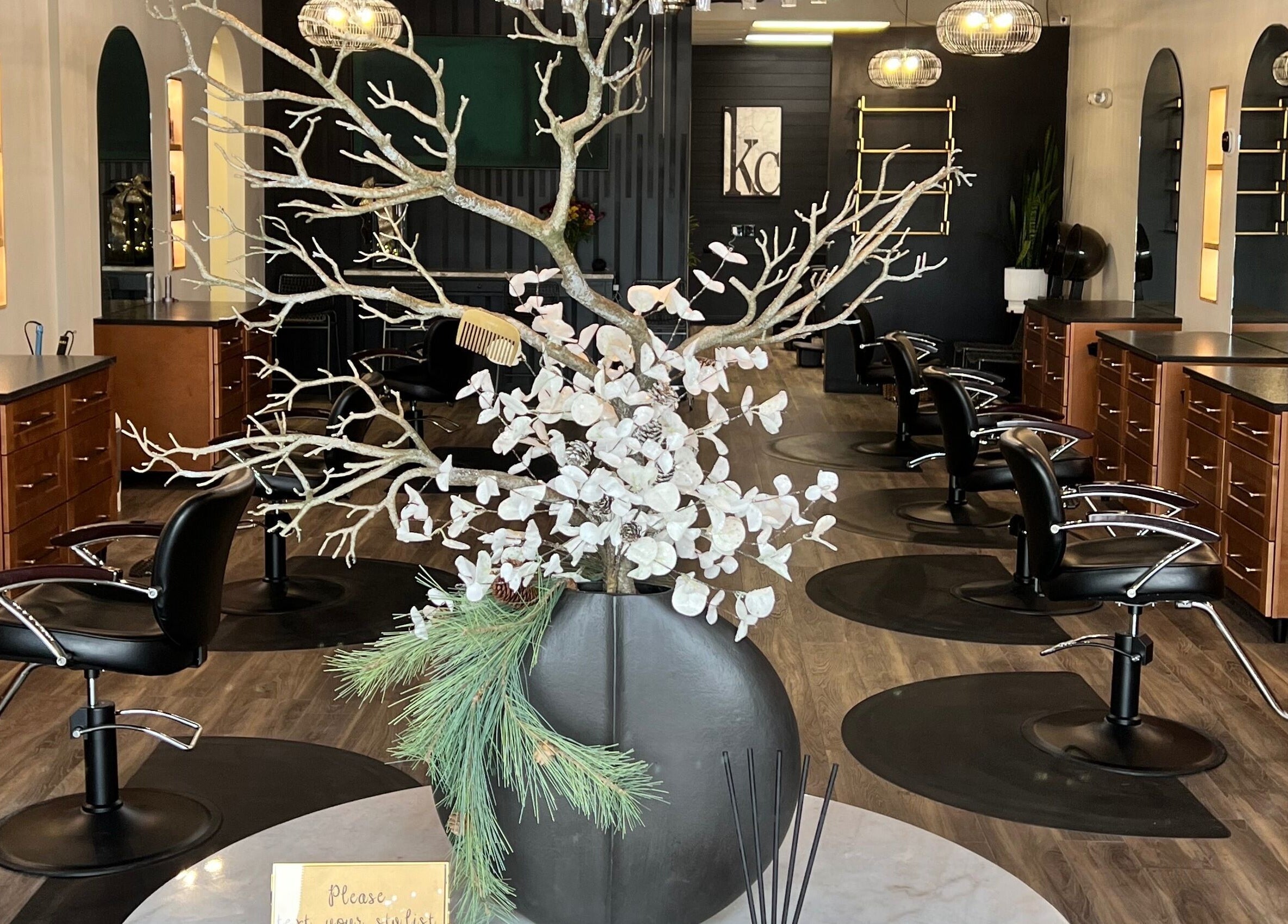 Elegant interior of Angie's Hair Salon Studio in Overland Park, Kansas, US showcasing modern styling chairs and decor.