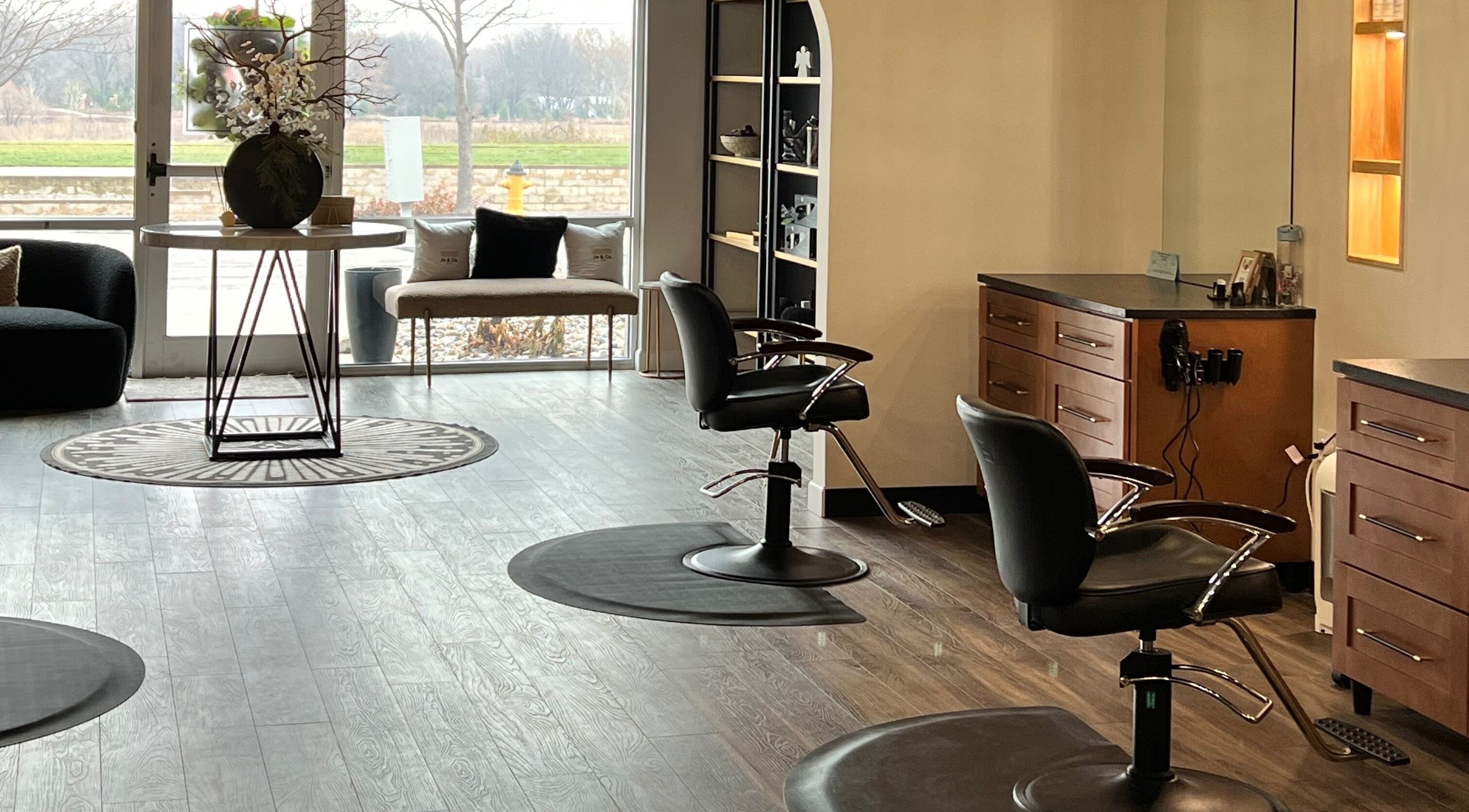 Sleek interior of Angie's Hair Salon Studio, Overland Park, Kansas, US showcasing modern styling chairs and decor.