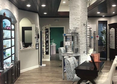 Interior of Oasis Med Spa, Venice, Florida, US showcasing stylish decor and comfortable seating.