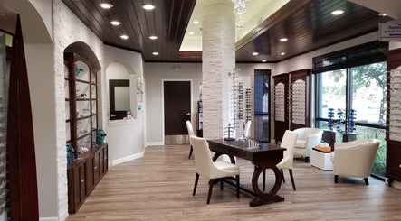 Tranquil interior of Oasis Med Spa in Venice, Florida, US, featuring elegant seating and ambient lighting.