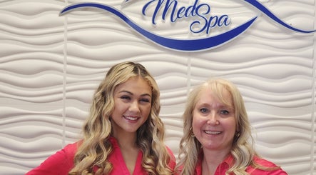 Staff at Oasis Med Spa, Venice, Florida, US, welcoming guests with smiles.