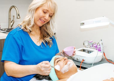 Aesthetician applying a facial at Oasis Med Spa, Venice, Florida, US.