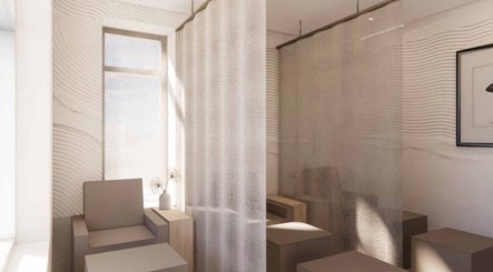 Tranquil seating area at Lux Beauty Bar • Hair Spa in Grimsby, Ontario, CA, with soft curtains and modern decor.