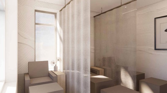 Tranquil seating area at Lux Beauty Bar • Hair Spa in Grimsby, Ontario, CA, with soft curtains and modern decor.