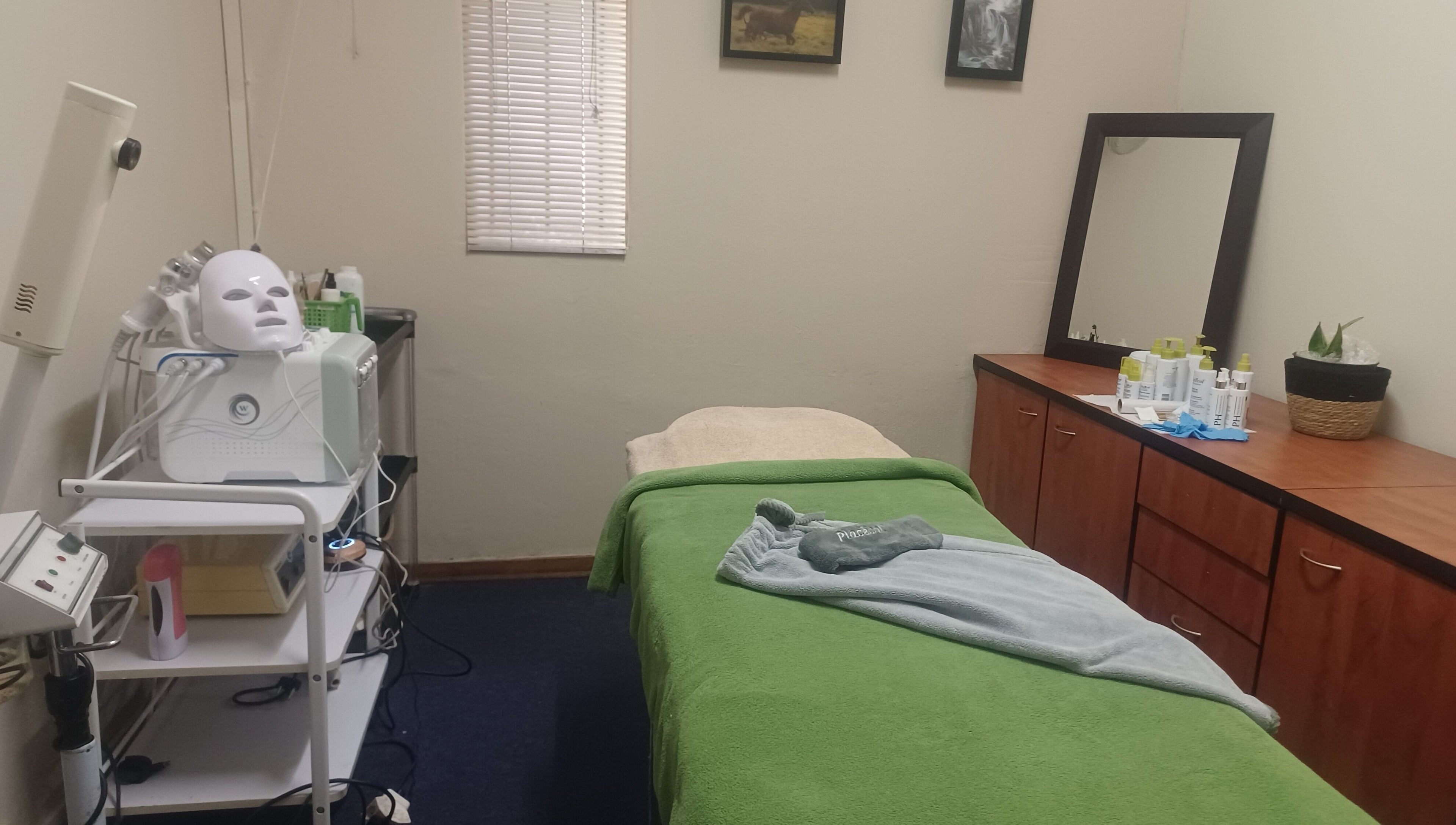 Cozy treatment room at Zader Beauty Bar, Johannesburg, Gauteng, ZA with a facial bed and skincare products.