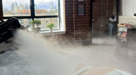 Relaxing steam therapy session at Jrbeautylab in London, England, GB, with cozy interior views.
