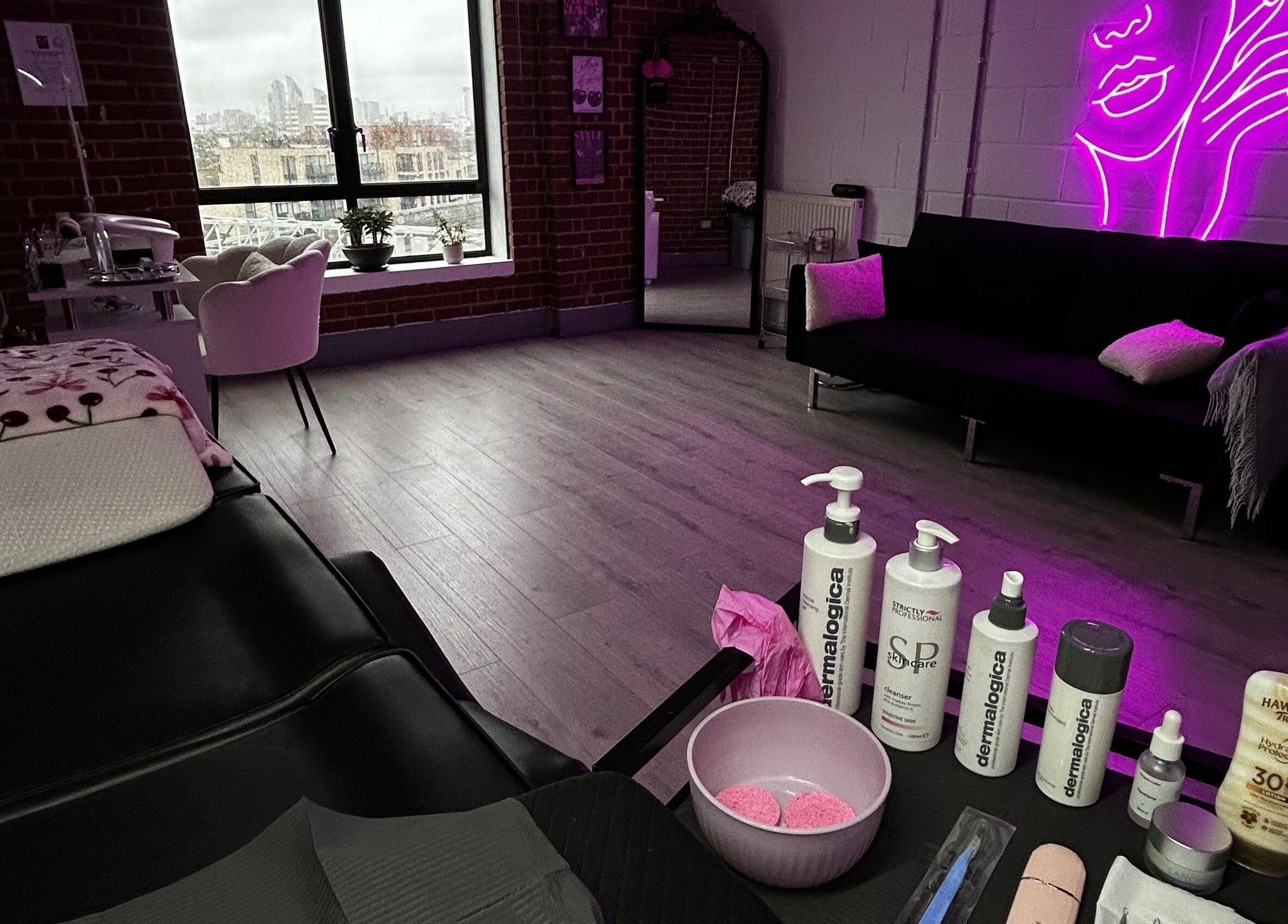 Jrbeautylab spa in London, England, GB, features vibrant decor with a relaxing massage setup.