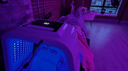 LED therapy session at Jrbeautylab, London, England, GB in a serene, ambient-lit treatment room.