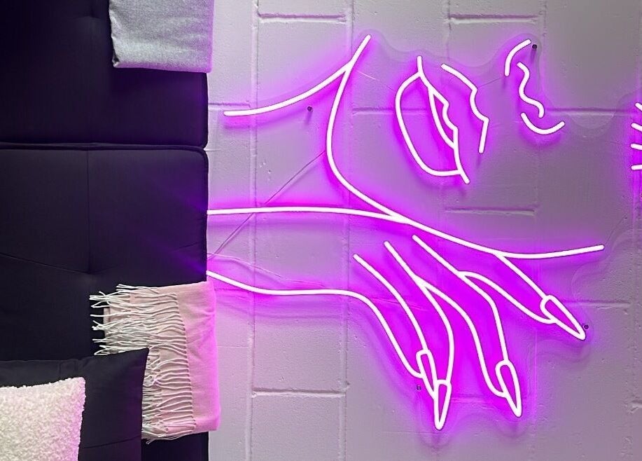 Vibrant neon art decorates the cozy corner of Jrbeautylab, London, England, GB.