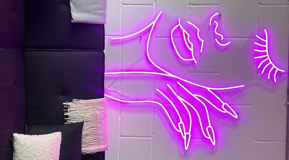 Vibrant neon art decorates the cozy corner of Jrbeautylab, London, England, GB.