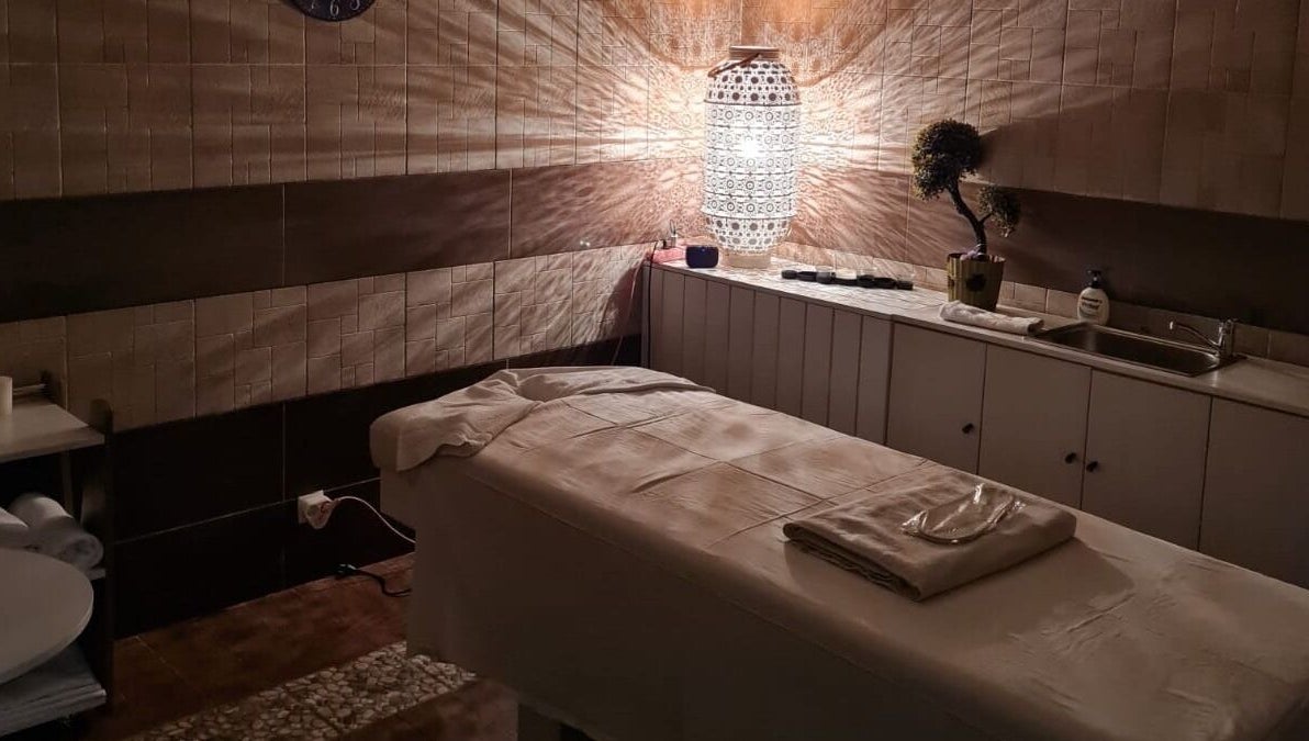 Relaxing treatment room at Premier Spa and Aesthetics, T'bilisi, Tbilisi, GE with ambient lighting.