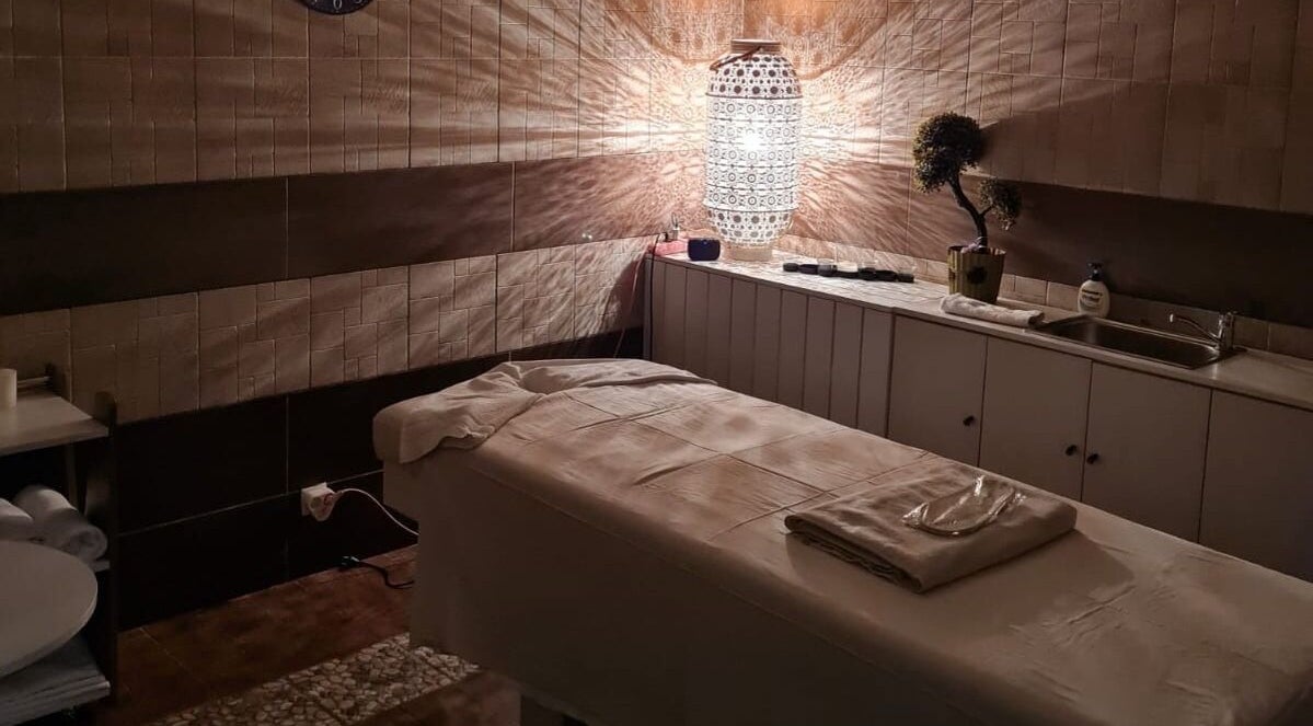 Relaxing treatment room at Premier Spa and Aesthetics, T'bilisi, Tbilisi, GE with ambient lighting.