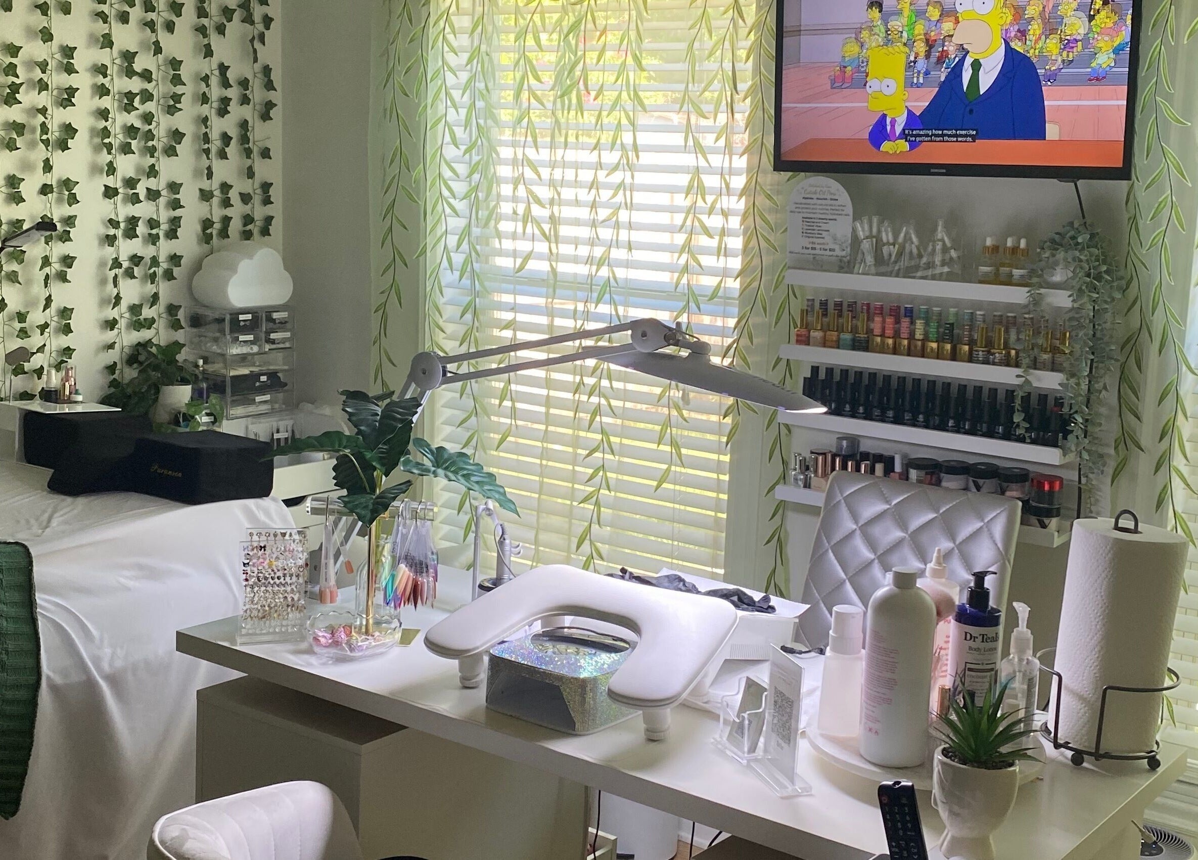 Relaxing beauty workspace at Polishedbycass, Ocoee, Florida, US, with greenery and organized nail products.