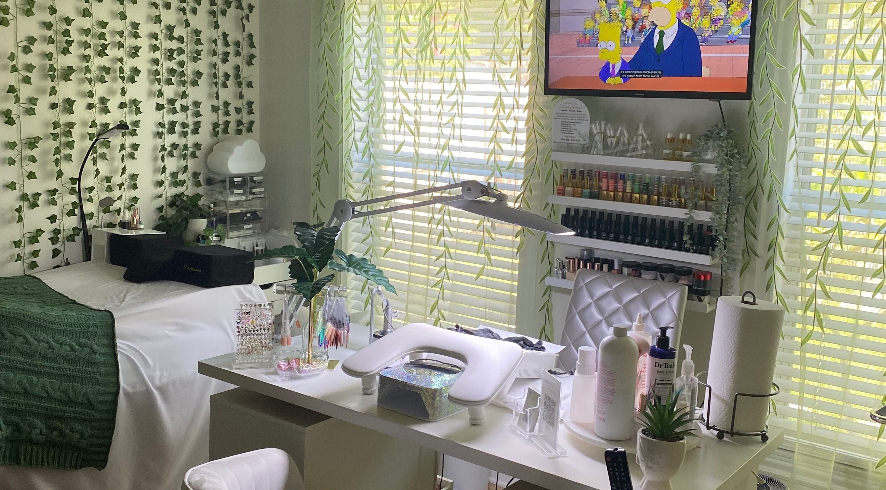Relaxing beauty workspace at Polishedbycass, Ocoee, Florida, US, with greenery and organized nail products.