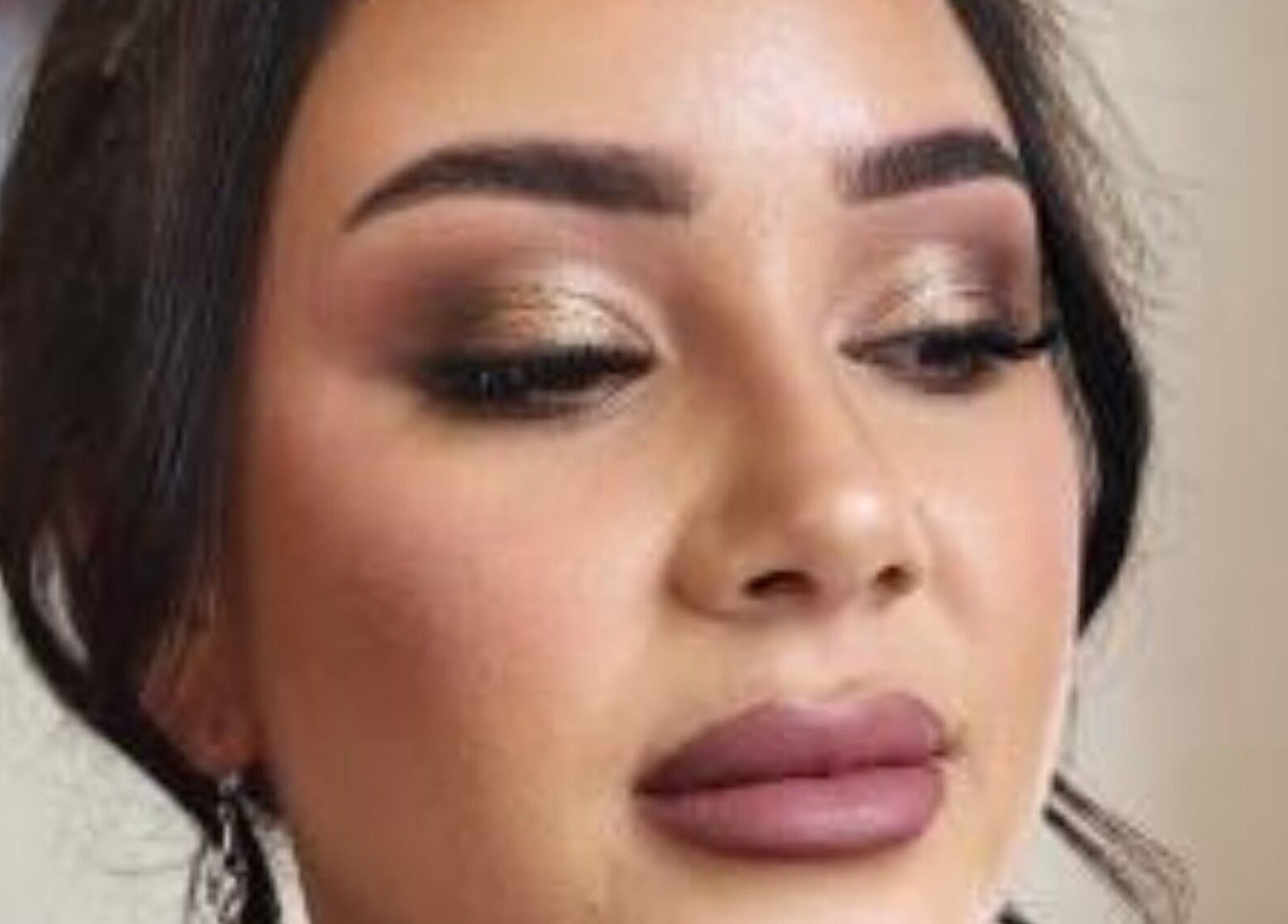 Elegant makeup showcasing golden eyes at Lisa Naughton Mua in Athleague, County Roscommon, IE.