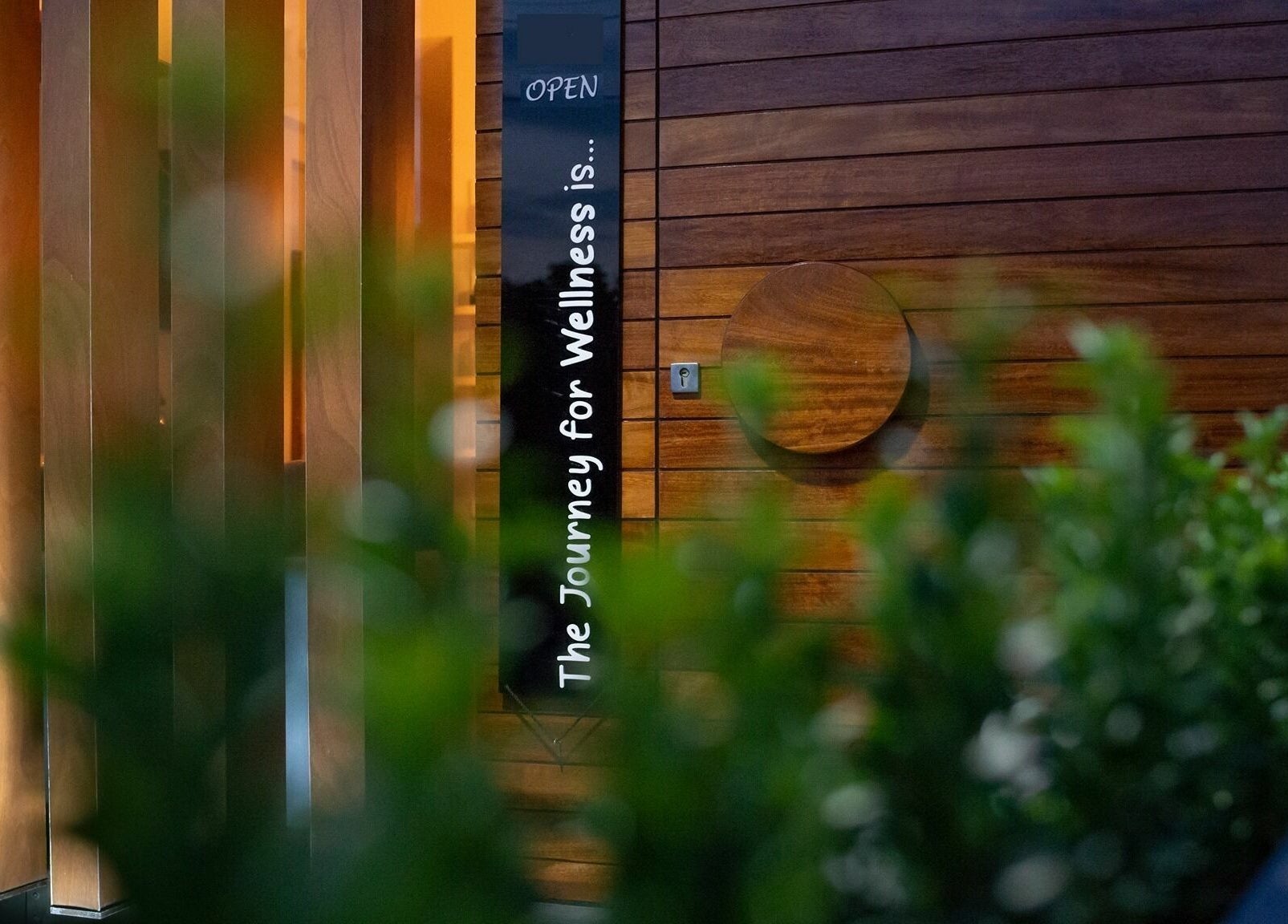 Wooden entryway at Suenso Spa, Limassol, Limassol, CY inviting guests to a journey for wellness.