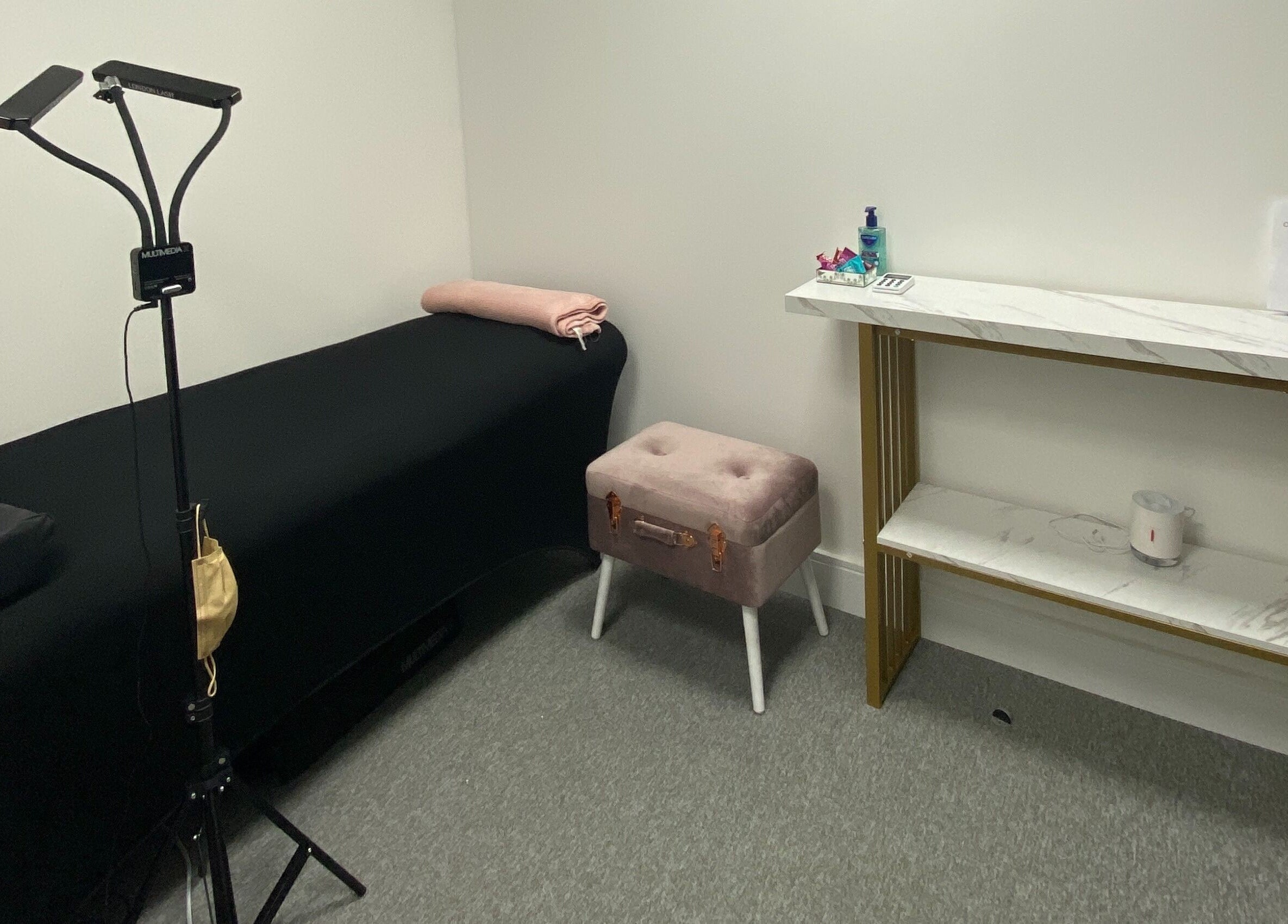 Serene spa room at Blink PN Lash, London, England, GB with soothing decor and treatment bed.