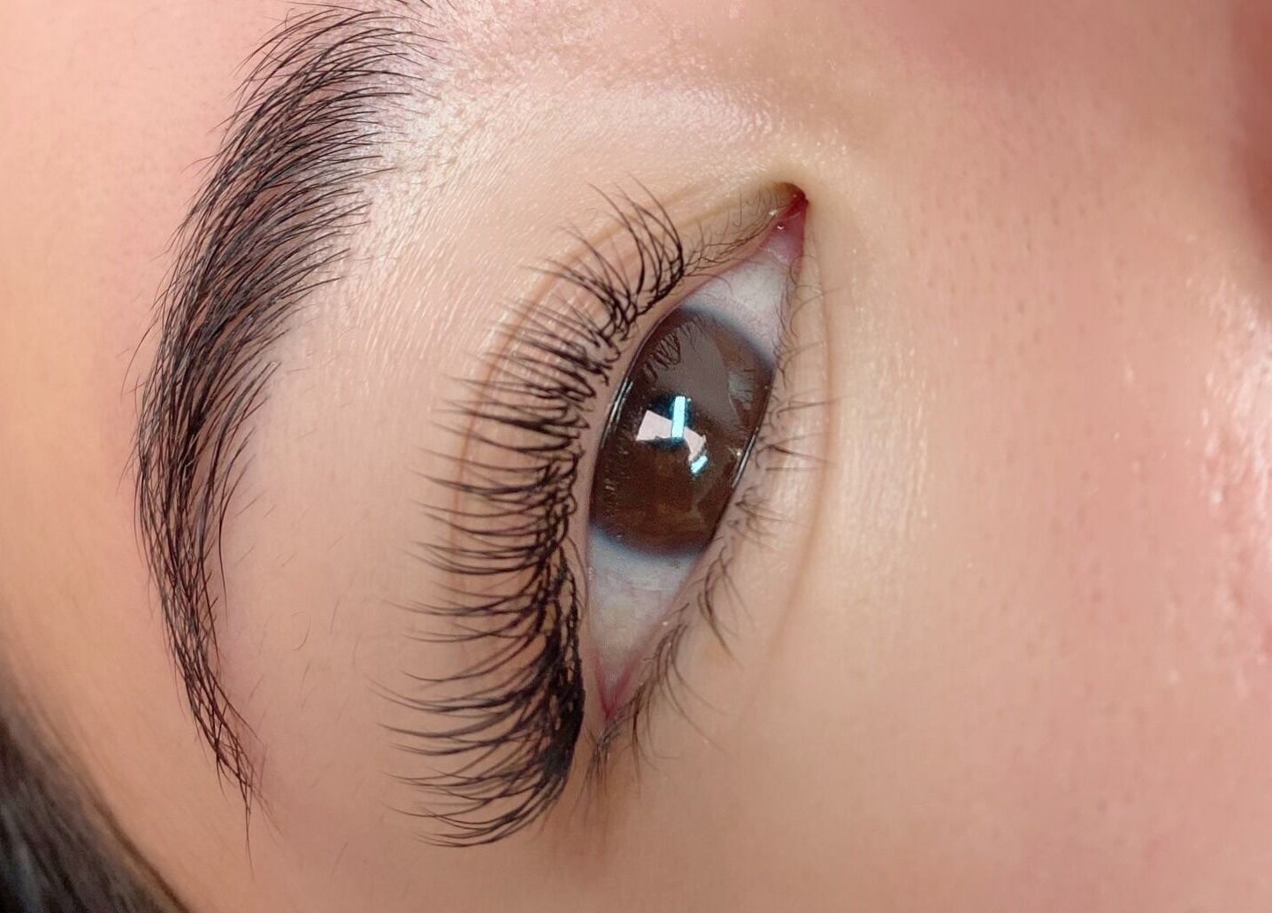 Close-up of eye with elegant lashes at Blink PN Lash, London, England, GB.