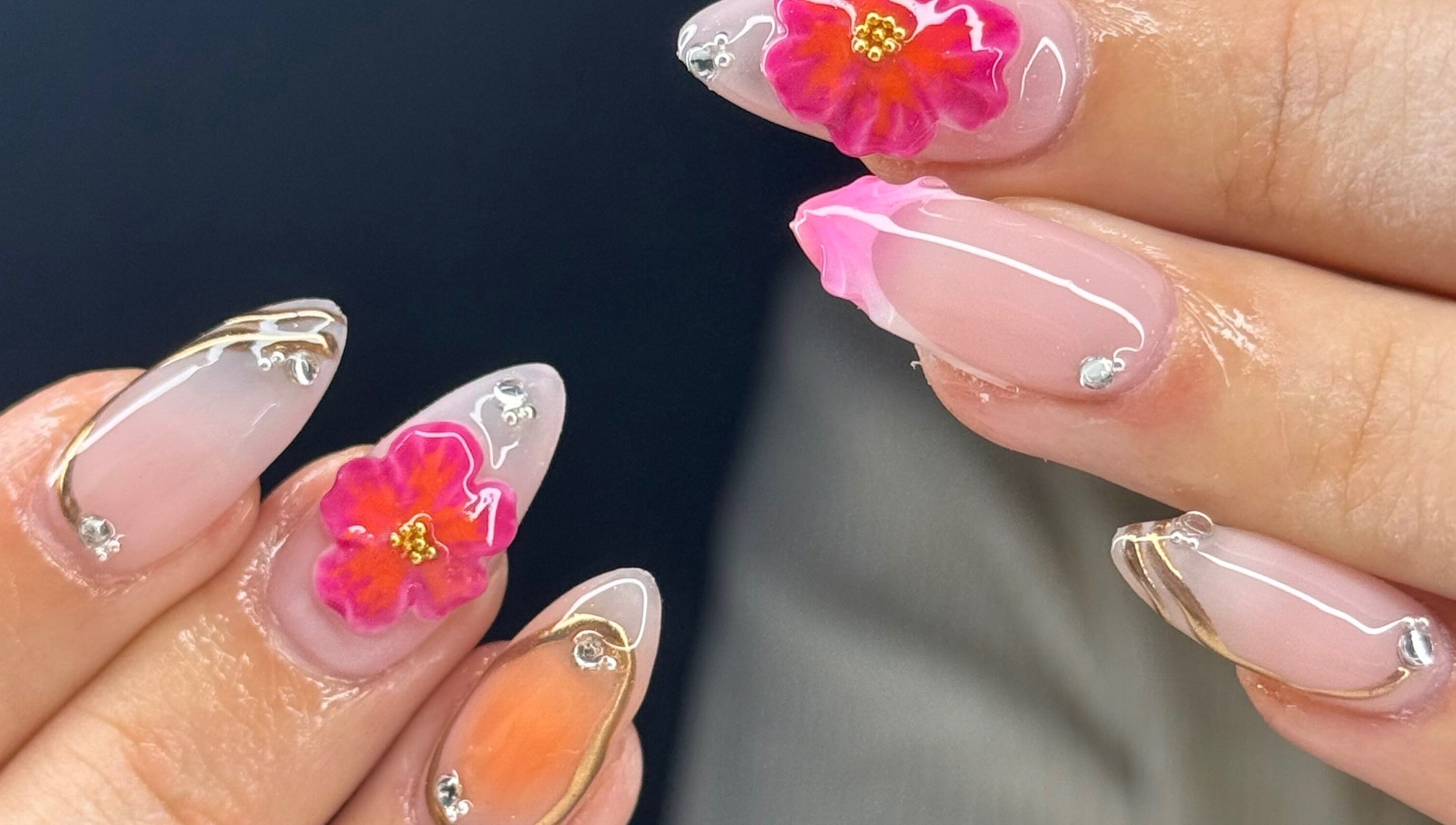 Intricate floral nail art at Montè Beauty, Melbourne, Victoria, AU, showcasing vibrant colors and delicate designs.