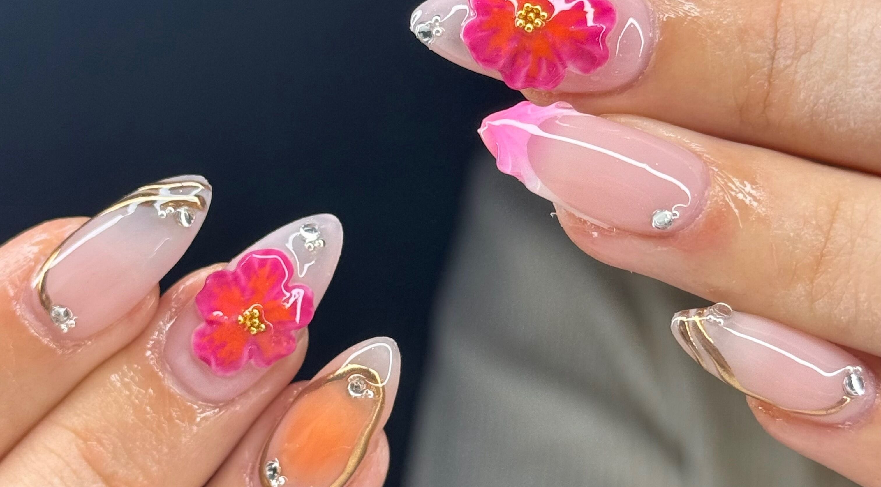 Intricate floral nail art at Montè Beauty, Melbourne, Victoria, AU, showcasing vibrant colors and delicate designs.