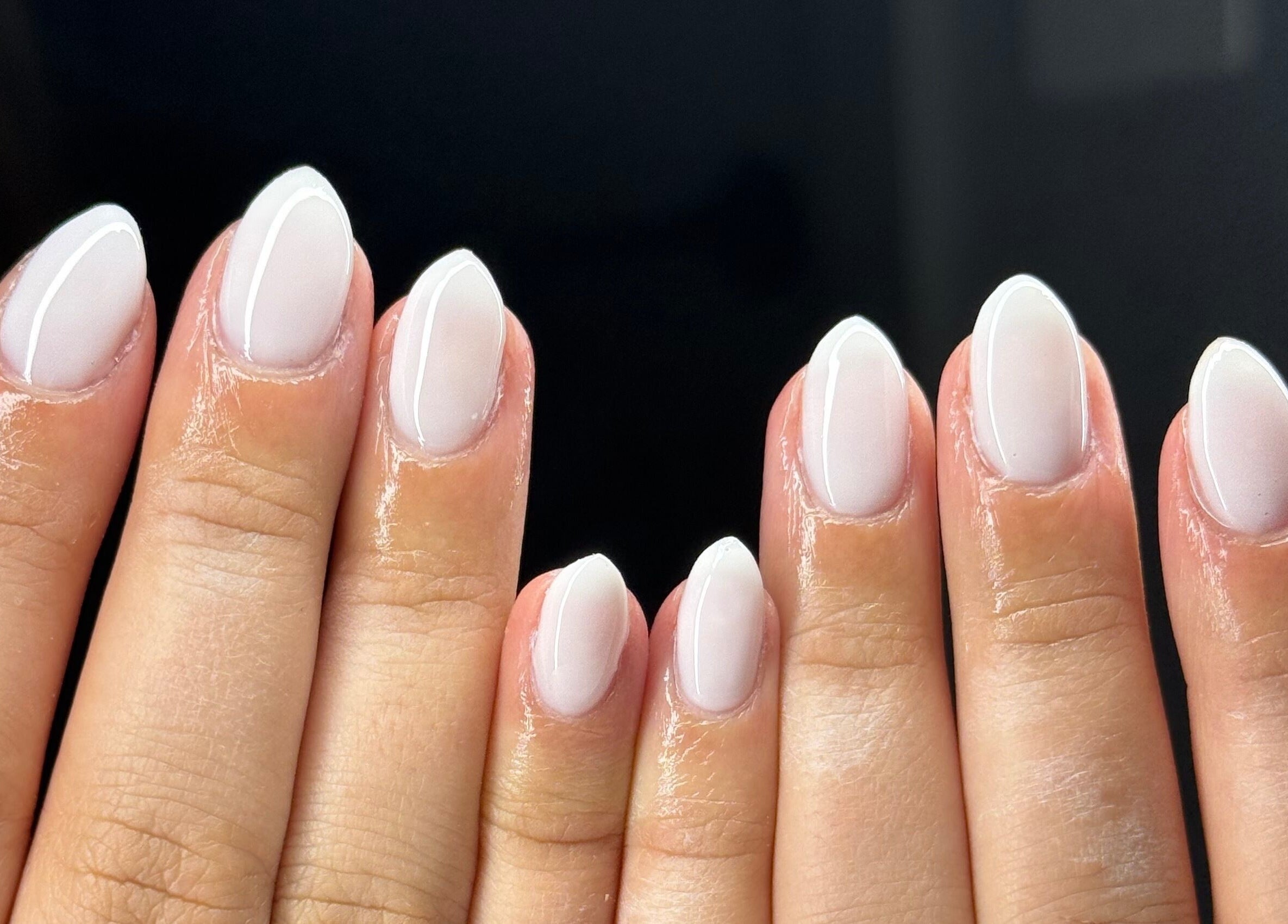 Close-up of elegant white manicure at Montè Beauty, Melbourne, Victoria, AU.