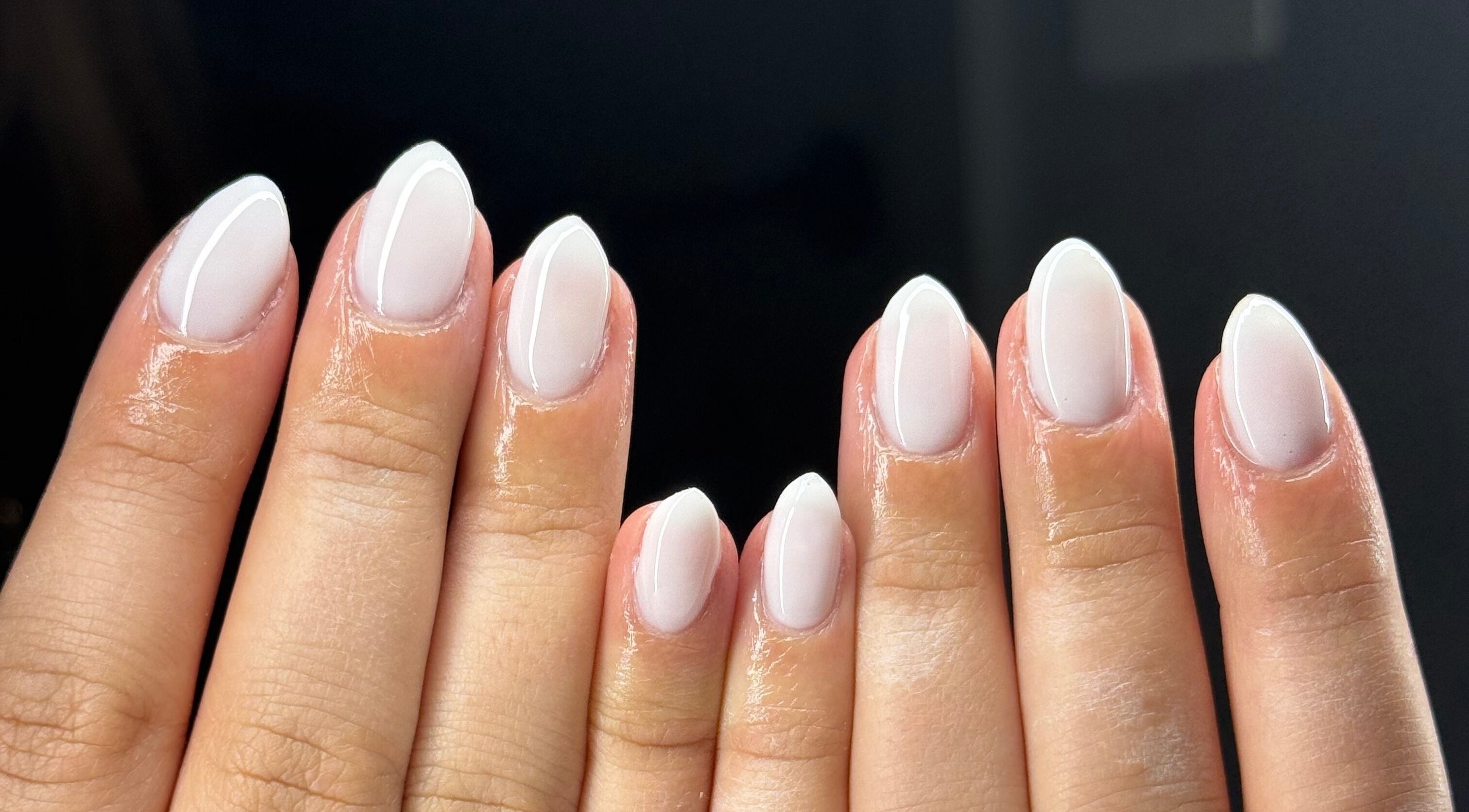 Close-up of elegant white manicure at Montè Beauty, Melbourne, Victoria, AU.