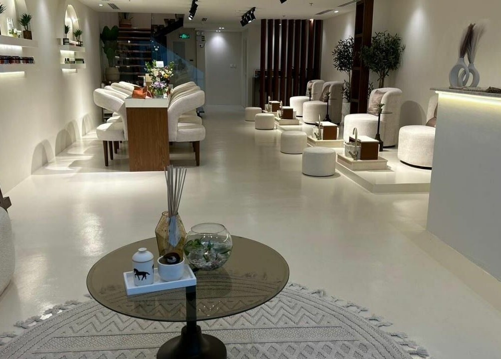 Chic interior of Noor Beauty Salon in Dammam, Eastern Province, SA featuring plush seating and modern decor.