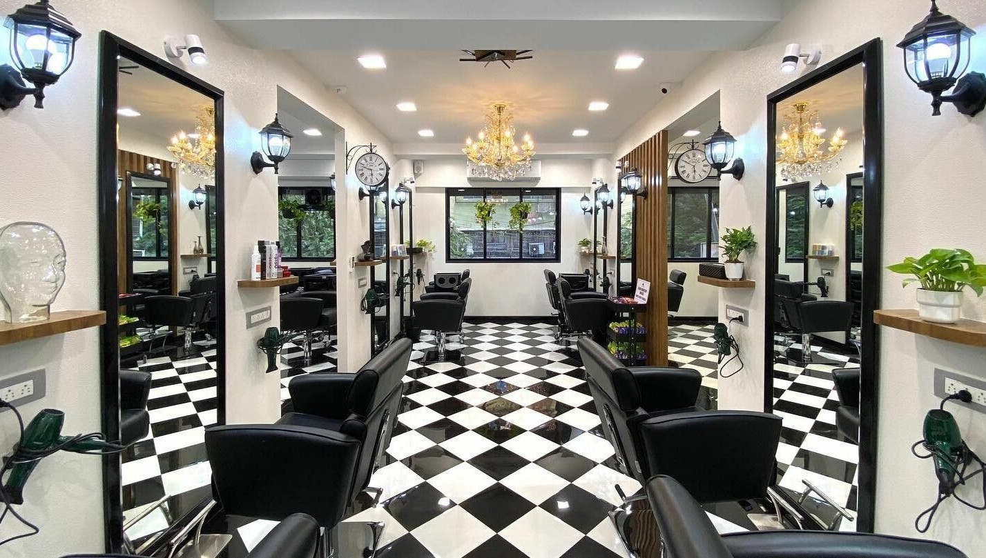 Elegant salon interior at Hair Castle - Dombivali, featuring sleek black chairs and stylish decor in Dombivli, Maharashtra, IN.