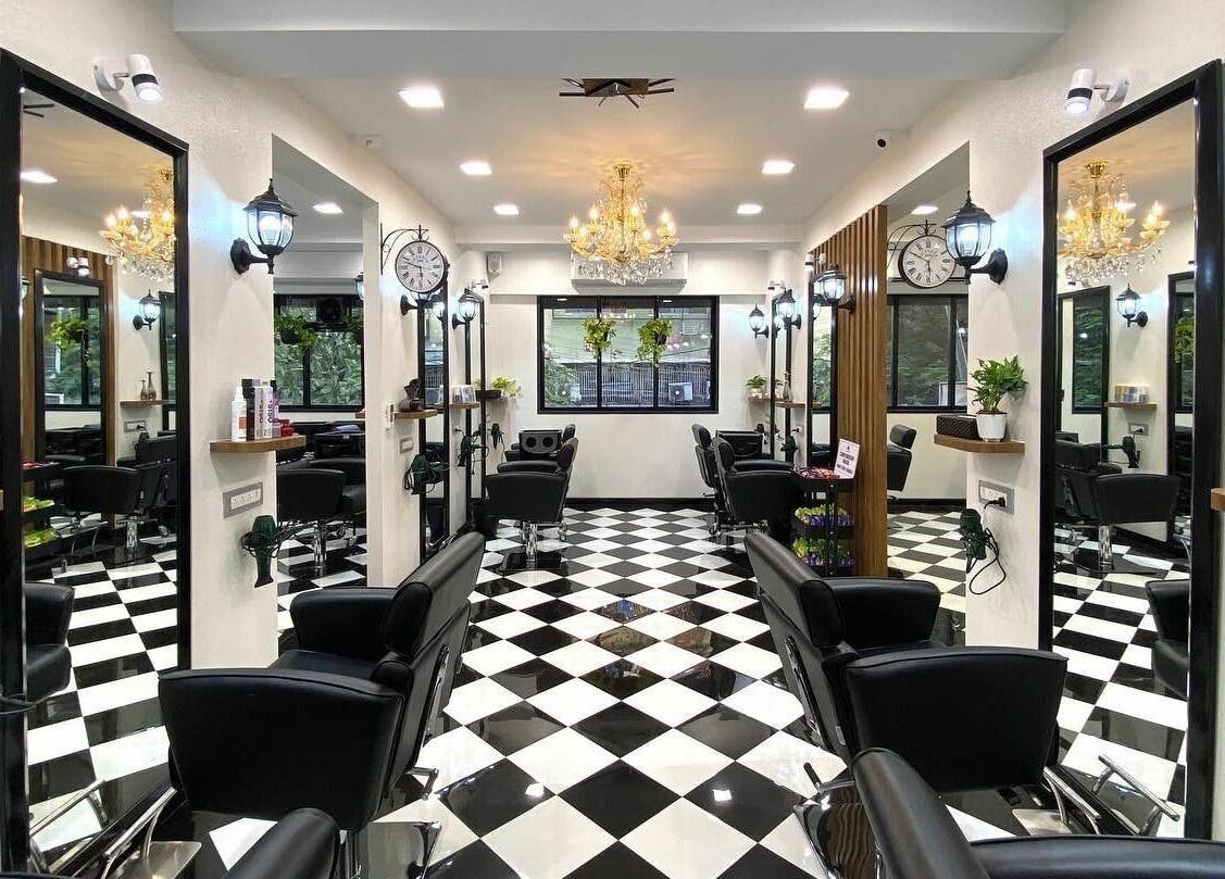 Elegant salon interior at Hair Castle - Dombivali, featuring sleek black chairs and stylish decor in Dombivli, Maharashtra, IN.