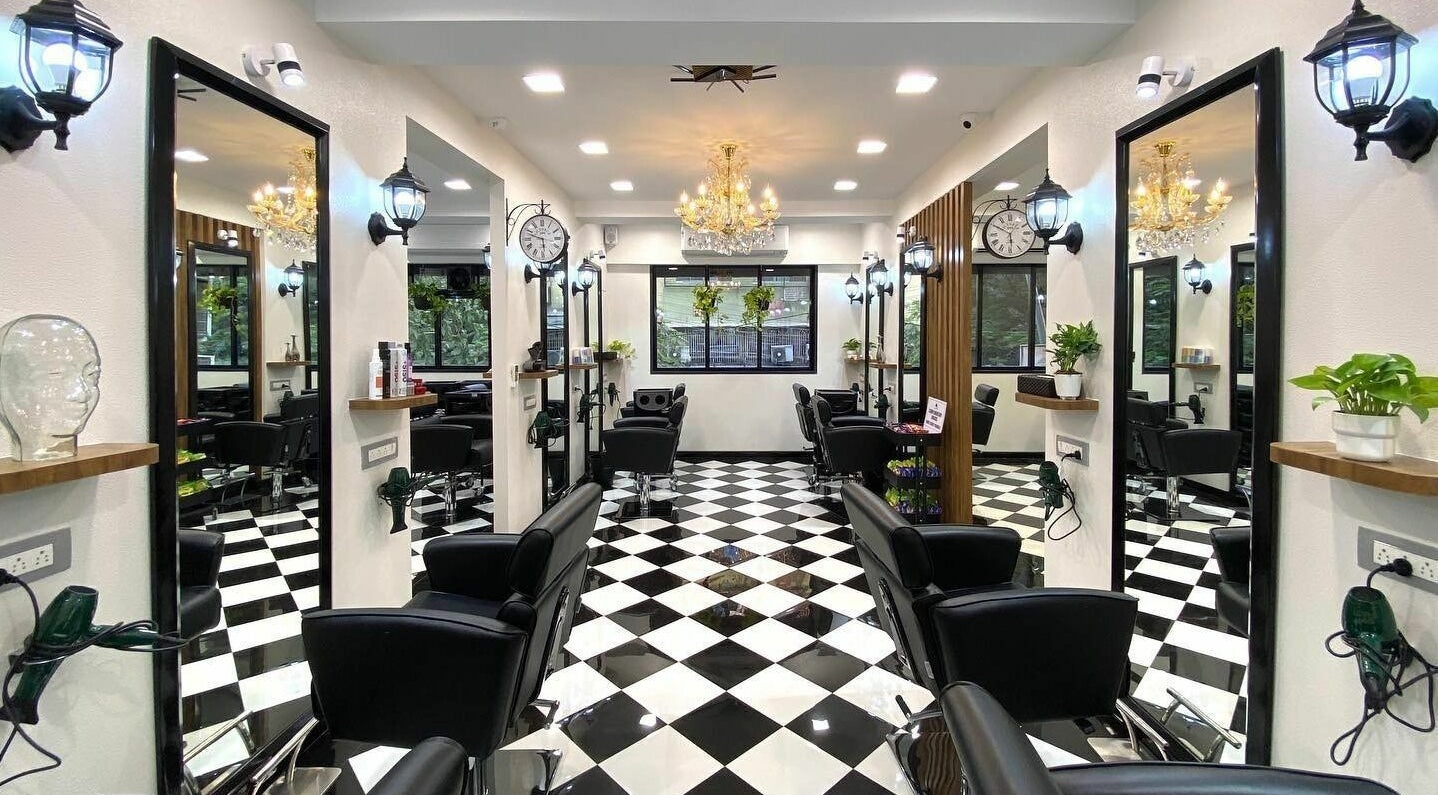 Elegant salon interior at Hair Castle - Dombivali, featuring sleek black chairs and stylish decor in Dombivli, Maharashtra, IN.