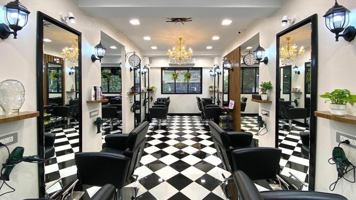 Elegant salon interior at Hair Castle - Dombivali, featuring sleek black chairs and stylish decor in Dombivli, Maharashtra, IN.