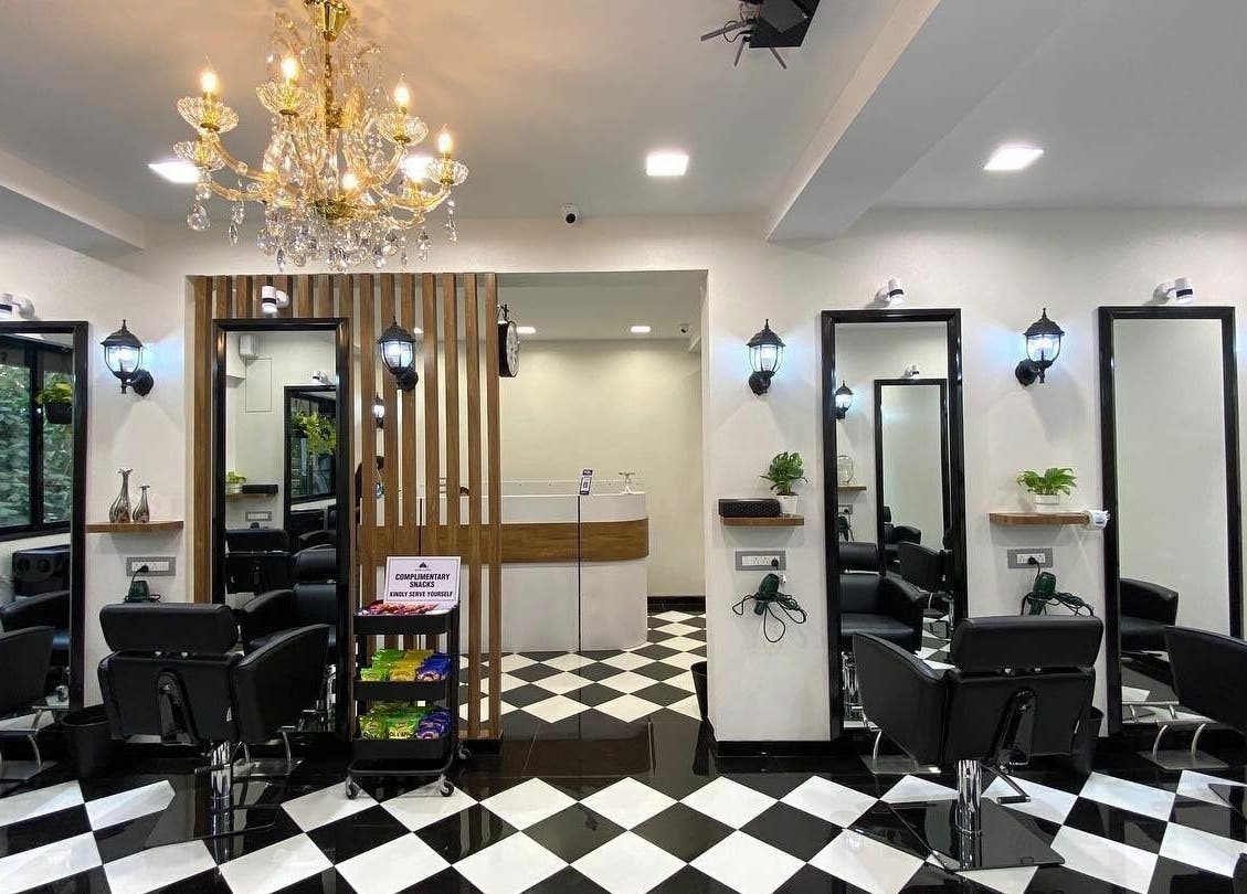 Elegant interior of Hair Castle - Dombivali, Dombivli, Maharashtra, IN, featuring stylish chairs and chic lighting.